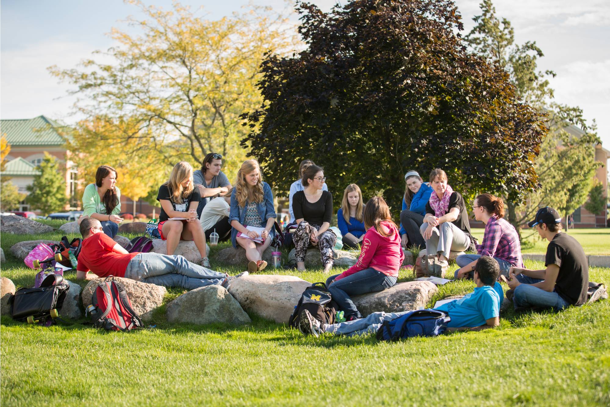 Image of people sitting outside together